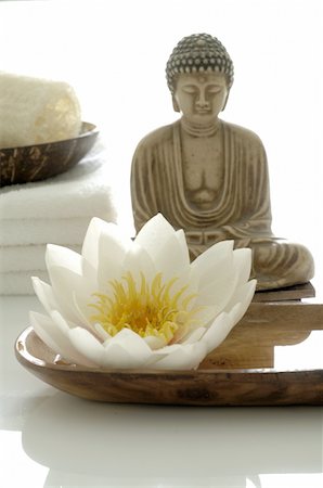 decoration - White water lily blossom, Buddha statuette and towels Stock Photo - Premium Royalty-Free, Code: 689-05612600