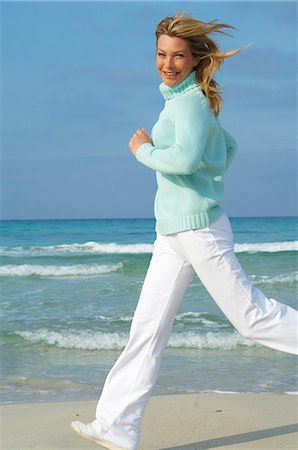 sandi model - Running woman on the beach Stock Photo - Premium Royalty-Free, Code: 689-03124561