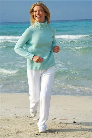 sandi model - Running woman on the beach Stock Photo - Premium Royalty-Free, Code: 689-03124562