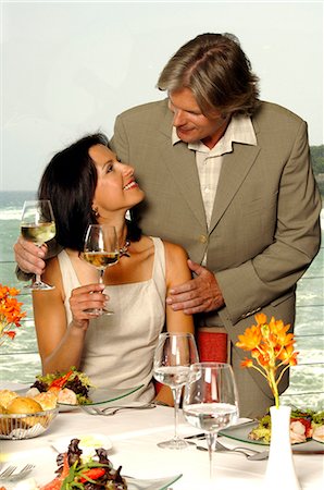 Couple at the sea with wine glasses Stock Photo - Premium Royalty-Free, Code: 689-03125474