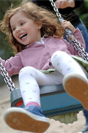 Swinging girl Stock Photo - Premium Royalty-Free, Code: 689-03130858