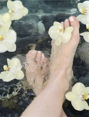 Woman taking footbath Stock Photo - Premium Royalty-Free, Code: 689-03733079