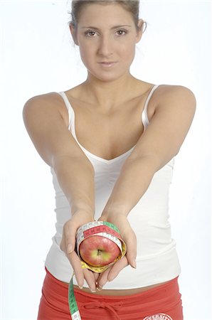 simsearch:689-03733468,k - Woman holding apple with tape measure Stock Photo - Premium Royalty-Free, Code: 689-03733159
