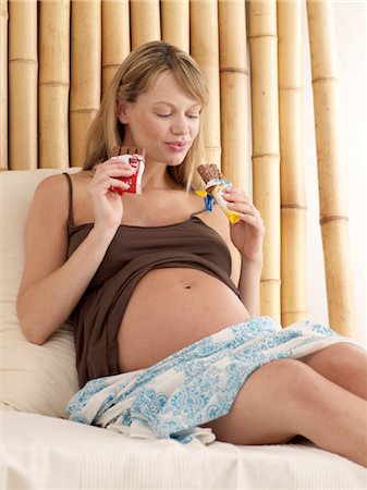 simsearch:689-03733616,k - Pregnant woman eating sweets Stock Photo - Premium Royalty-Free, Code: 689-03733178