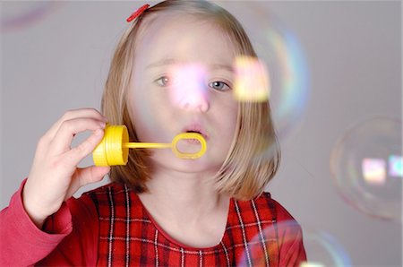 simsearch:632-05604245,k - Girl blowing soap bubbles Stock Photo - Premium Royalty-Free, Code: 689-03733354