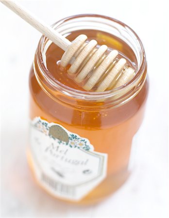 Honey dipper in glass Stock Photo - Premium Royalty-Free, Code: 689-03733691
