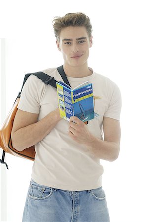 person tshirt rucksack - Man holding travel guide Stock Photo - Premium Royalty-Free, Code: 689-03733706