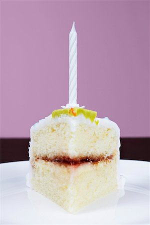 simsearch:630-02219911,k - Slice of cake with birthday candle, close-up Stock Photo - Premium Royalty-Free, Code: 694-03328136