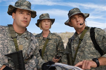 Soldiers in field looking at map Stock Photo - Premium Royalty-Free, Code: 694-03328359