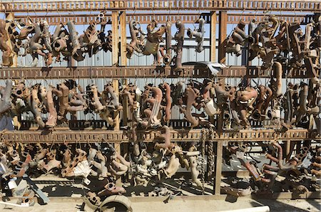 simsearch:694-03328729,k - Rusty car parts on rack Stock Photo - Premium Royalty-Free, Code: 694-03328688