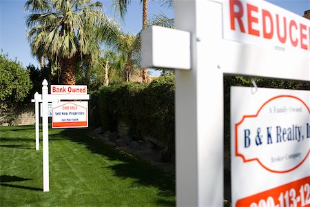 Real Estate Signs at Foreclosed Property Stock Photo - Premium Royalty-Free, Code: 694-03329128