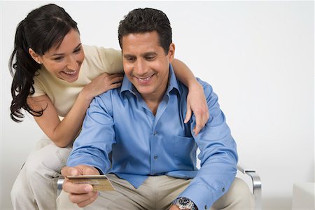 paid - Couple Holding Credit Card Stock Photo - Premium Royalty-Free, Code: 694-03329296