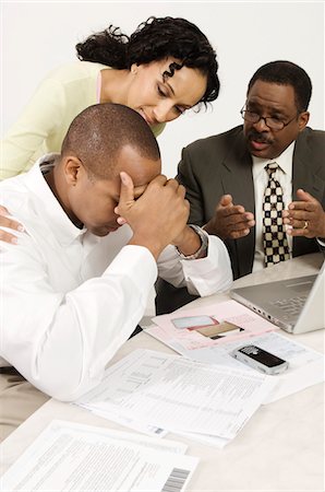 Accountant Giving Couple Bad News Foto de stock - Sin royalties Premium, Código: 694-03329379