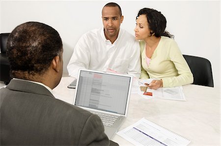 Couple Working with Accountant Stock Photo - Premium Royalty-Free, Code: 694-03329390