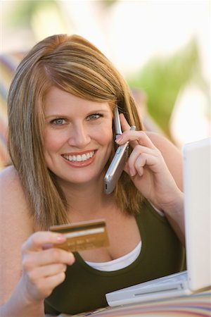 Woman Making Credit Card Purchase Stock Photo - Premium Royalty-Free, Code: 694-03320682
