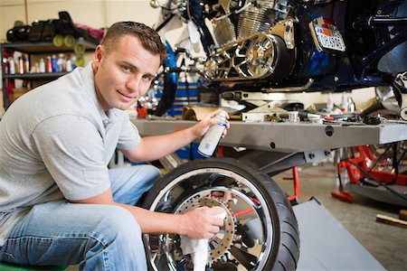 Mechanic Working on a Tire Stock Photo - Premium Royalty-Free, Code: 694-03330273