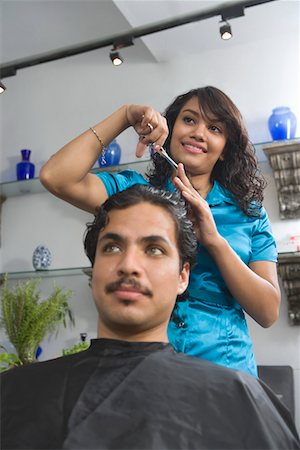 Hairdresser cutting mans hair Stock Photo - Premium Royalty-Free, Code: 694-03332042
