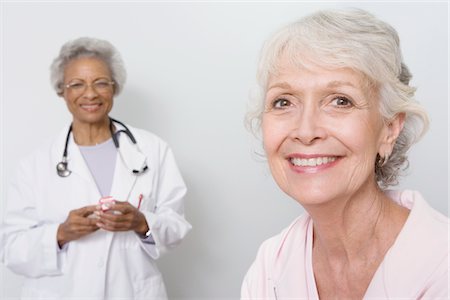 senior woman and doctor and two people - Portrait of senior medical practitioner and patient Stock Photo - Premium Royalty-Free, Code: 694-03332865