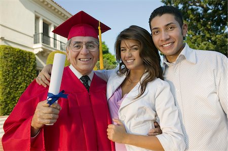 simsearch:693-06014177,k - Senior Graduate with son and daughter outside, portrait Stock Photo - Premium Royalty-Free, Code: 694-03692637