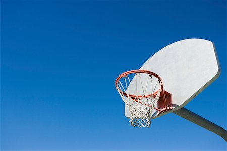 Basketball hoop, low angle view Stock Photo - Premium Royalty-Free, Code: 694-03692669