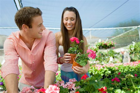 portrait man shirt shop - Young couple choosing potted flowers in garden center Stock Photo - Premium Royalty-Free, Code: 694-03693023