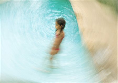 simsearch:695-03374346,k - Girl standing in swimming pool, blurred motion Stock Photo - Premium Royalty-Free, Code: 695-05764244