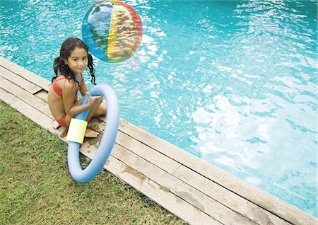 simsearch:695-03374346,k - Girl sitting by edge of pool, holding floating ring Stock Photo - Premium Royalty-Free, Code: 695-05764243