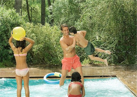 Father and children playing in swimming pool Stock Photo - Premium Royalty-Free, Code: 695-05764256