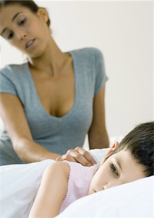 simsearch:632-03424324,k - Child lying in bed, mother watching Stock Photo - Premium Royalty-Free, Code: 695-05764363