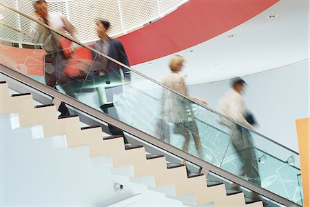 people going down stairs side view - Business executives going up and down staircase Stock Photo - Premium Royalty-Free, Code: 695-05764522