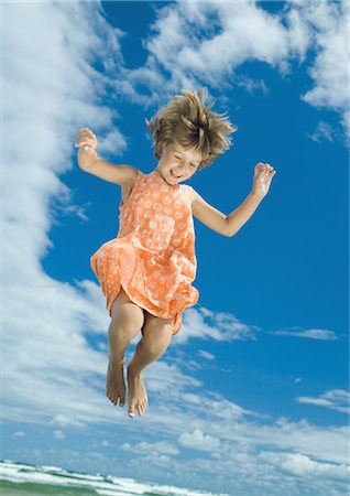 simsearch:649-07647801,k - Girl jumping in mid air, sky in background Stock Photo - Premium Royalty-Free, Code: 695-05765238