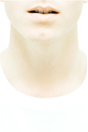 Young man's lower face and neck, close-up Foto de stock - Sin royalties Premium, Código: 695-05765715