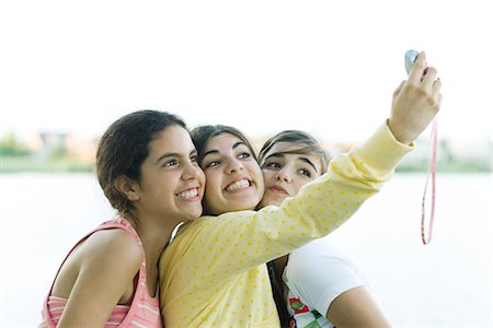 simsearch:695-03388794,k - Young female friends taking photo of selves with cell phone Stock Photo - Premium Royalty-Free, Code: 695-05766244