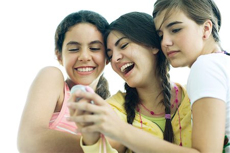 simsearch:695-03388794,k - Young female friends looking at cell phone together, laughing Stock Photo - Premium Royalty-Free, Code: 695-05766243