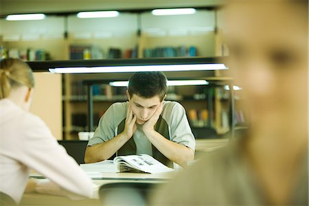 student exhausted - Students studying in library Stock Photo - Premium Royalty-Free, Code: 695-05766393