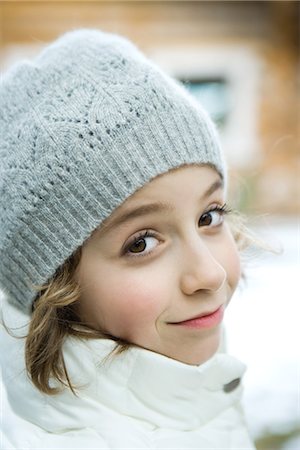 preteen girls faces photo - Girl in winter clothes smiling at camera, close-up Stock Photo - Premium Royalty-Free, Code: 695-05766614