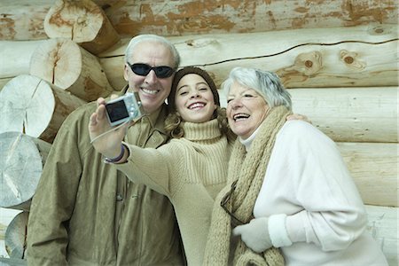 simsearch:696-03401677,k - Teen girl taking photo of self with grandparents Stock Photo - Premium Royalty-Free, Code: 695-05766779