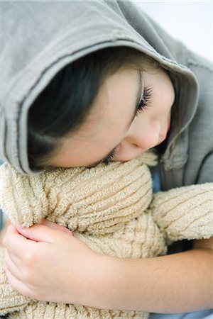 sad girls - Little girl resting head on teddy bear, close-up Stock Photo - Premium Royalty-Free, Code: 695-05767117