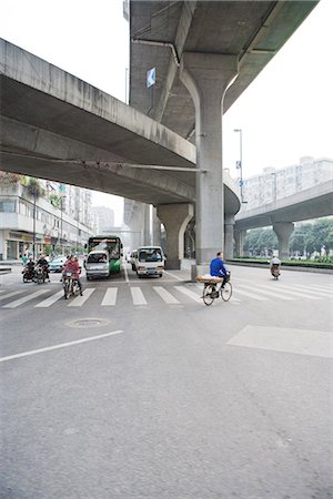 Bike and car traffic under overpasses Stock Photo - Premium Royalty-Free, Code: 695-05767350