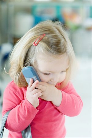 simsearch:695-05768235,k - Blonde toddler girl holding cell phone to ear Stock Photo - Premium Royalty-Free, Code: 695-05767368