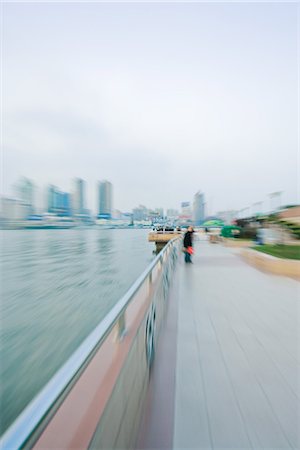 panning (camera technique) - Riverside walkway, blurred motion Stock Photo - Premium Royalty-Free, Code: 695-05767394