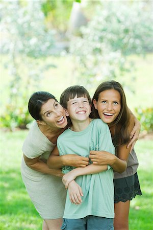 simsearch:695-05769087,k - Mother embracing son and teen daughter, all smiling and looking up Stock Photo - Premium Royalty-Free, Code: 695-05768356