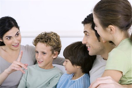 simsearch:632-05816381,k - Family sitting together, having a discussion Stock Photo - Premium Royalty-Free, Code: 695-05769096