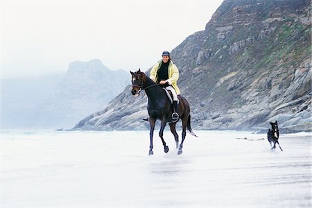 Man riding horse on beach Stock Photo - Premium Royalty-Free, Code: 695-05769428