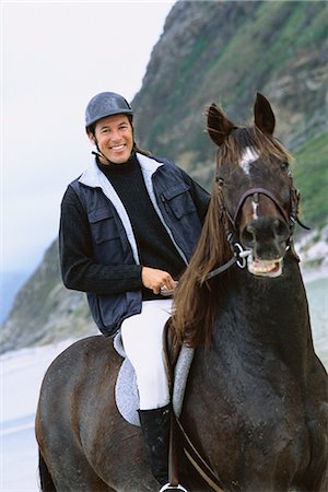 Man riding horse on beach, portrait Stock Photo - Premium Royalty-Free, Code: 695-05769430