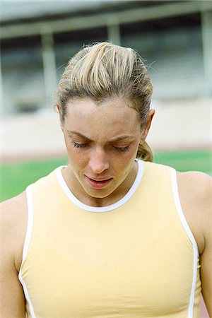 Woman with head down, close-up Stock Photo - Premium Royalty-Free, Code: 695-05769875