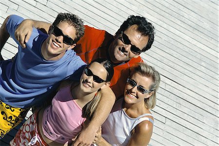 Family with two children standing together smiling at camera, high angle view Stock Photo - Premium Royalty-Free, Code: 695-05769881