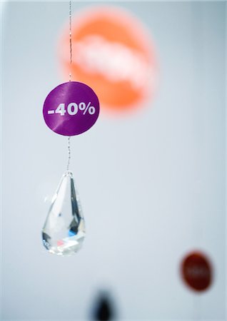 reduction - -40% sign hanging on crystal pendant Stock Photo - Premium Royalty-Free, Code: 695-05762981