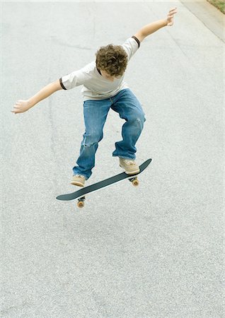Boy jumping with skateboard Stock Photo - Premium Royalty-Free, Code: 695-05763508