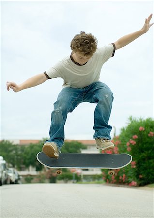 Boy jumping with skateboard Stock Photo - Premium Royalty-Free, Code: 695-05763509